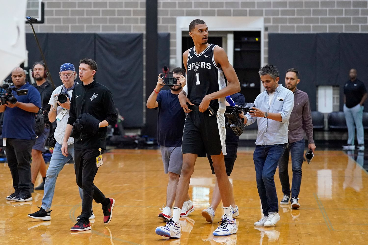 San Antonio Spurs center Victor Wembanyama enters the court during Media Day.
